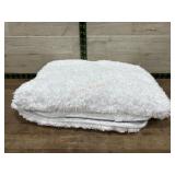2- small white bath mats