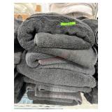Stack of black bath towels