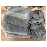 Stack of blue bath towels and wash rags