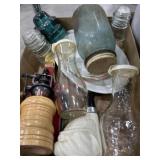 Flat with old juice bottles, plates, glassware