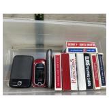 Tote of playing cards and old cell phones