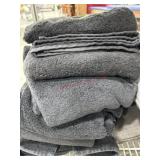 Stack of 5 black bath towels