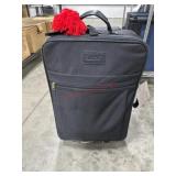 Black suitcase with clothes