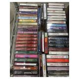 Flat of mixed genres music cassettes