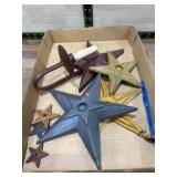 Metal star decorations and candle holder