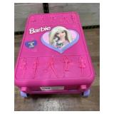 Barbie doll case full of dolls and clothes