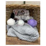 Basket of yarn and unfinished baby coverlet