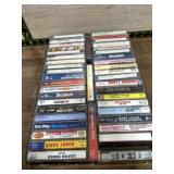 Flat of mixed genres music cassettes