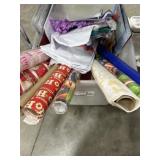 Tote of gift wrapping supplies. paper, bags and