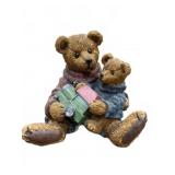 Figurine of Two Bears With Toy Car