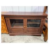 Wooden Media Console With Glass Doors