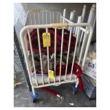 WHITE METAL CRIB ON WHEELS