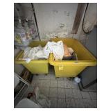 YELLOW PLASTIC ROLLING LAUNDRY TUBS WITH CONTENTS
