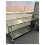 STAINLESS STEEL WORK TABLE WITH LOWER SHELF ON WHE