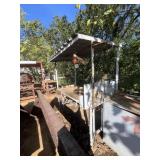 COVERED WORK STATION WITH TANK HOLDERS, REEL, BAR