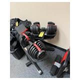 BOWFLEX ADJUSTABLE DUMBBELLS ON STAND