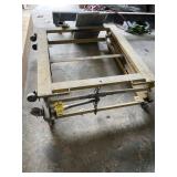 YELLOW ACCORDION LIFT ON WHEELS