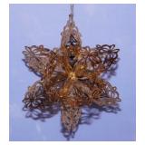 Several metal filigree Christmas tree ornaments