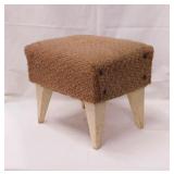 Mid Century upholstered footstool w/ tapered