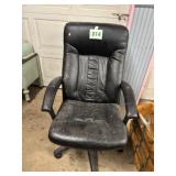 Black leather type high back office chair on