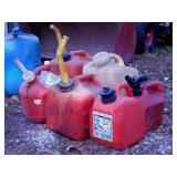 6 plastic gas fuel cans, largest is 2 1/2 gallons