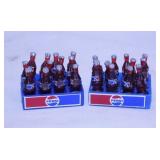 Two mini 12 pack Pepsi bottles in cases,