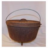 Lodge #12 cast iron dutch oven w/ coal lip lid
