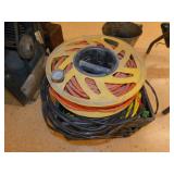 4 electrical extension cords and plastic milk