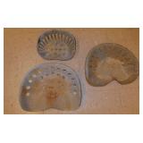 3 metal implement tractor seats, 1 is cast iron