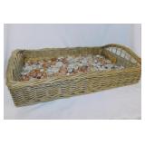 Wicker tray full of iridescent glass floral