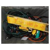 Electrical extension cords in flip top storage