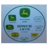 John Deere embossed metal sign, 12" diam. -