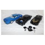 3 plastic built model cars