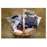 Large woven basket full of new clothing