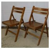 Pair of solid wood folding chairs marked Romania