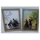 Pair of convex glass silhouettes in frames,
