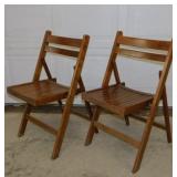 Pair of solid wood folding chairs marked Romania