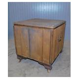 Antique portable oak commode on wooden casters,