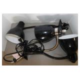 3 black clamp-on lights
