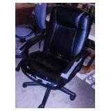 Office Max executive leather chair on casters,