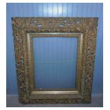 Antique ornate frame w/ wavy glass, 28" x 32"