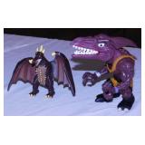 Several toy dinosaurs and reptiles