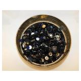 Black mourning buttons in round metal tin