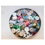 Metal tin of sewing thread, wood & plastic spools