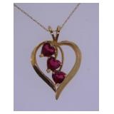 10K yellow gold heart pendant w/ 3 rubies on