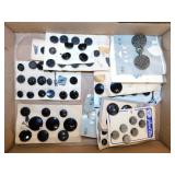 Black mourning buttons sewn on display cards