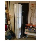 Metal rollup door, 75" wide, may not be complete
