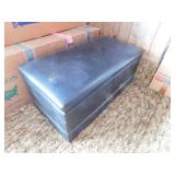 Vinyl upholstered storage ottoman, 33" x 17" x