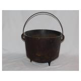Antique cast iron 3 toed kettle w/ bail handle,