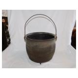 Antique cast iron 3 toed kettle w/ bail handle,